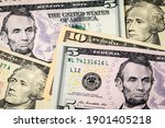 Closeup of ten and five dollar bills. Concept of 15 dollar federal minimum wage increase.