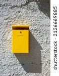 Yellow Mailbox On The Wall At...