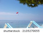 Boat Pulls Red Parachute With...