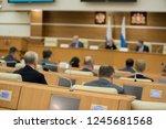 Session of Government. Conference room or seminar meeting room in business event. Academic classroom training course in lecture hall. blurred businessmen talking. modern bright office indoor