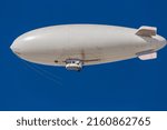 A white blimp  airship  or...