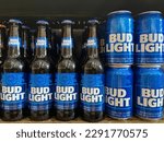 Small photo of La Fortuna, Costa Rica - April 12, 2023: Bottles and cans of Bud Light on display on a store shelf