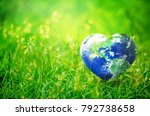 Earth in Heart shape on green grass on sunlight, Love and Save the World for the Next Generation concept, Earth day concept, Elements of this image furnished by NASA