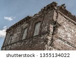old crumbling brick building, dilapidated, abandoned