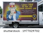 Small photo of Washington, DC – May 18, 2021: A truck feature a likeness of Dr. Anthony Fauci as Uncle Sam and questioning his supposed expenditures through the NIH on dangerous animal virus experiments in China.