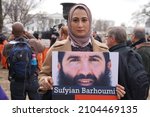 Small photo of Washington, DC – January 11, 2018: Demonstrators at a Close Guantanomo protest at the White House hold photos of detainees putting a face on their ongoing plight.