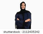 Small photo of Portrait of UAE woman in Hijab Abaya looking far away the camera. Beautiful Emirati female wearing cultural outfit common in the Emirates
