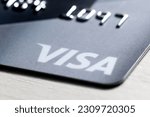 Small photo of Moscow, Russia - May 28, 2023: Detail of an international payment and withdrawal bank card with the Visa logo shot close-up. Visa is an American payment system used in most parts of the world