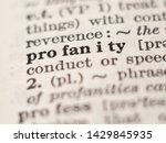 Small photo of Dictionary definition of word profanity, selective focus.