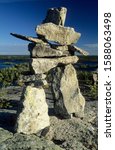 Cairn or stone man or inukshuk at the Hidden Lakes, Ingraham Trail, Northwest Territories, Canada
