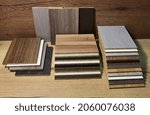 Small photo of Samples of fibreboard panels with wood texture. Laminated CPD. Chipboard PVC edge. Wooden furniture CMD and MDF.