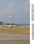 Small photo of CHANGI, SINGAPORE -22 AUG 2019- An airplane from Scoot (TZ), a low-cost long-haul airline owned by Singapore Airlines, in the air at the Singapore Changi Airport (SIN).