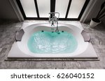 jacuzzi bath tub on marble floor with water