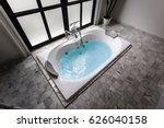 jacuzzi bath tub on marble floor with water