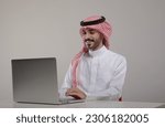 A saudi character sites at the...