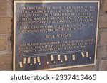 Small photo of San Diego, CA USA - April 7, 2023: The plaque showing the displaced graves after the new boundary was place at El Campo Santo Cemetery at old Town San Diego, USA. Over as many as 18 displaced graves.