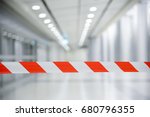 Red and White Lines of barrier tape. At subway station of airport background.Red White warning tape pole fencing is protects for No entry