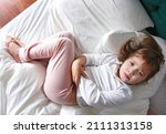 Child In A Bed With Stomach...