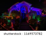 Small photo of A Halloween decorated house with eerie lighting, creepy skeletons, ghastly ghouls and spooky pumpkins.