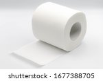 Sanitary and household, Close up detail of one single clean toilet paper roll lay on white background, Tissue is a lightweight paper or light crepe paper.