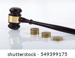 Small photo of Lady of justice, Wooden and gold gavel on white background isolated. too high gratification, symbol, corruption and bribe in government, actions for compensation, sue, lawsuit for damages, divorce