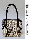 Small photo of Grey bag for women with reptile imitation leather and zip closure