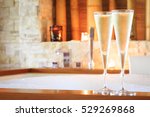 Two glasses of champagne near jacuzzi. Valentines background. Romance concept. Horizontal
