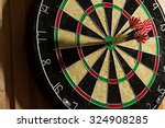 The darts isolated on wooden...