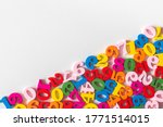 Colorful wooden numbers on part of background with copy space. Numbers texture abstraction on part of board. Top view of multicolor numbers from zero to nine. Mathematic topic. Back to school concept