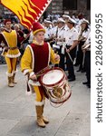 Small photo of Siena, Italy - August 14 2022: Valdimontone Contrada Drummer and Flag Bearer at the Procession of the Candles and Censors before the Palio.