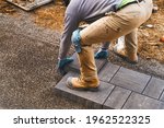Landscaping Paver Worker Laying ...