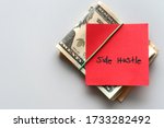 Dollars cash money and paper note with text written SIDE HUSTLE on background - concept of financial planning - make more extra money from parttime side hustle or second job