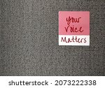 Small photo of Pink sticker on wallpaper with text written YOUR VOICE MATTERS, concept of expressing one internal world out to the public space, every voices deserves to be heard