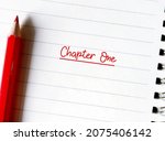 Small photo of Red pencil on notebook with text written CHAPTER ONE, concept of first time book writing, author start his novel, forst chapter creative writing