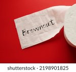 Small photo of Toilet paper on red background with handwritten word BROWNOUT - Employees feel overworked, demotivated and disengaged – which is essentially the stage before burnout