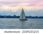 Small photo of Venice,Italy-February 8th 2015:Yacht sailing off shore Lido island in Venice lagoon.The Lido is Venice’s relaxed seaside resort. In winter, this thin strip of land has a quiet, workaday vibe.