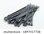 Grey plastic cable ties isolated on a white background