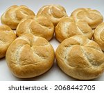 Fresh Kaiser rolls baked bread. Kaiser is a type of round, hard, and crunchy bread originally from Austria.