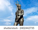 Small photo of Bologna - Italy - December 18, 2023: Famous statue of Neptune with trident. Fountain of Neptune in Bologna. Italy.