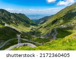 Beautiful mountain road with blue sky and high peaks. Transfagarasan highway, probably the best road in the world