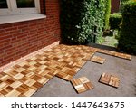 Lay Wooden Tiles On A Terrace....