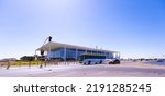 Small photo of Brasilia, Federal District - Brazil. August, 14, 2022. The Palacio do Plano in the background in the city of Brasilia and vehicles stopped in front of a traffic light.