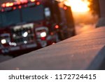 Fire truck pulls up to the scene of an accident at sunset