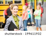 School Bus: Cheerful School Principal With Students In Background