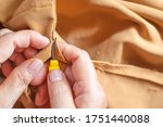 Hands Of Seamstress Is Using A...