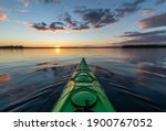 Kayaking At Sunset On A Calm...