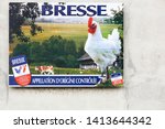 Small photo of Vonnas, France - May 22, 2018: Advertisement for the famous Bresse chicken on a wall. The Bresse is a French chicken product which has appellation d'origine controlee status