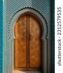 Small photo of Traditional Moroccan ancient wooden entry door. In the old Medina in Chefchaouen, Morocco. Typical, old, blue intricately carved, studded, Moroccan riad door.