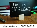 Small photo of I am on sick leave sign on the workplace.