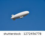 Large white dirigible airship...